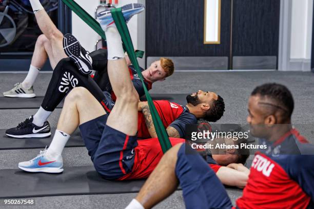 Sam Clucas, Kyle Bartley, Connor Roberts and Jordan Ayew exercise in the gym during the Swansea City Training at The Fairwood Training Ground on...
