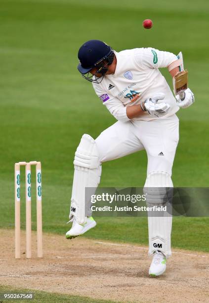 Kyle Abbott of Hampshire is struck by a bouncer during the Specsavers County Championship: Division One match between Surrey and Hampshire on Day 4...