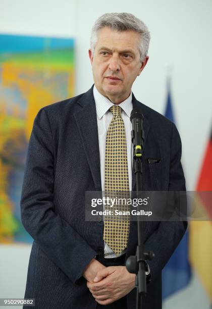 High Commissioner for Refugees Filippo Grandi and German Chancellor Angela Merkel give statements to the media prior to talks at the Chancellery on...