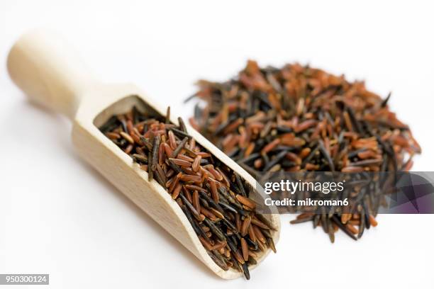 wild, black and red rice directly above view, macro shot. traditional food. - wilde rijst stockfoto's en -beelden