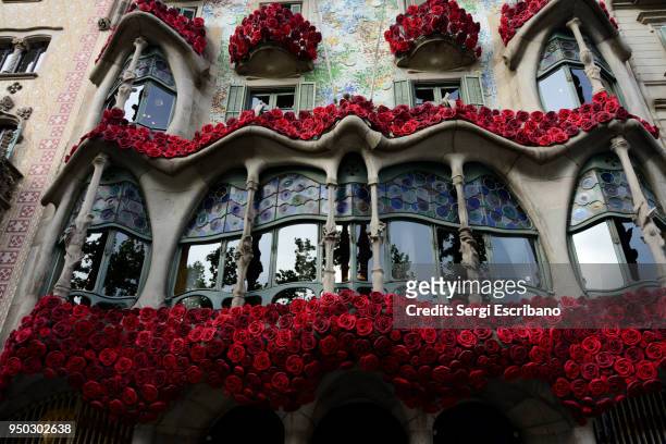 casa batllo by the famous architect antoni gaudi decorated to celebrate the day of sant jordi - casa rosa stock pictures, royalty-free photos & images