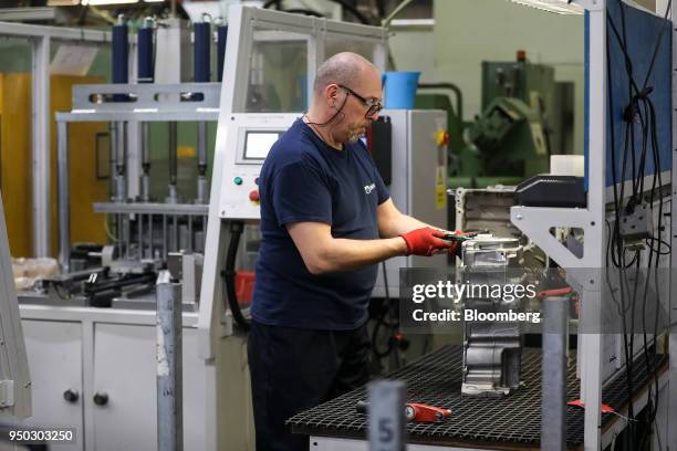 An employee inspects a panther ladder frame at Liberty Aluminium Technologies in Coventry, U.K., on Monday, April 23, 2018. Aluminum markets are...