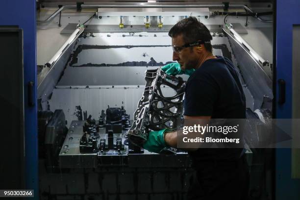 An employee moves a panther ladder frame from a cutting machine at Liberty Aluminium Technologies in Coventry, U.K., on Monday, April 23, 2018....