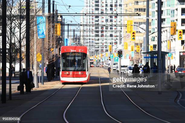 Streetcar and overall design of the bike car and TTC interacting at York and Queens Quay. The streetcar tracks are a no-go zone for autos.Rene...