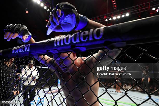Chase Sherman leans against the cage during a fight against Justin Willis in their heavyweight fight during the UFC Fight Night event at the...