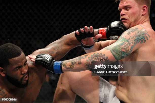 Chase Sherman and Justin Willis exchange punches in their heavyweight fight during the UFC Fight Night event at the Boardwalk Hall on April 21, 2018...