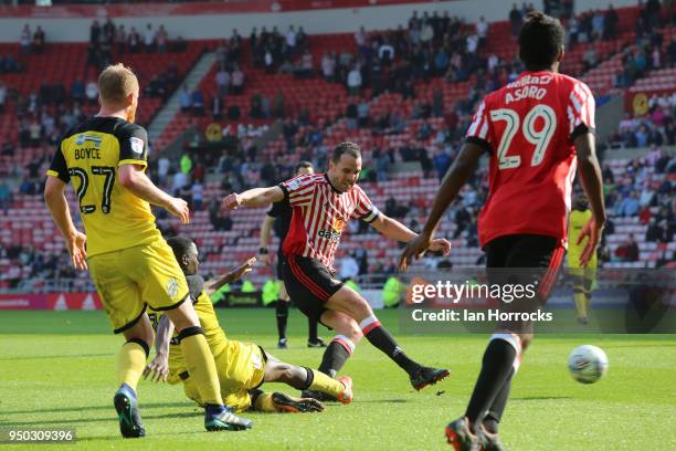 John O'Shea of Sunderland shoots on goal during the Sky Bet Championship match between Sunderland and Burton Albion at Stadium of Light on April 21,...