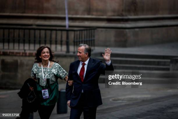 Jose Antonio Meade, presidential candidate of the Institutional Revolutionary Party , right, waves while arriving with his wife Juana Cuevas for the...