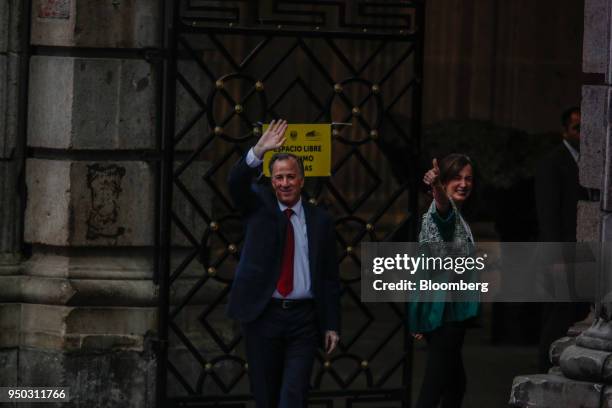 Jose Antonio Meade, presidential candidate of the Institutional Revolutionary Party , right, waves while arriving with his wife Juana Cuevas for the...