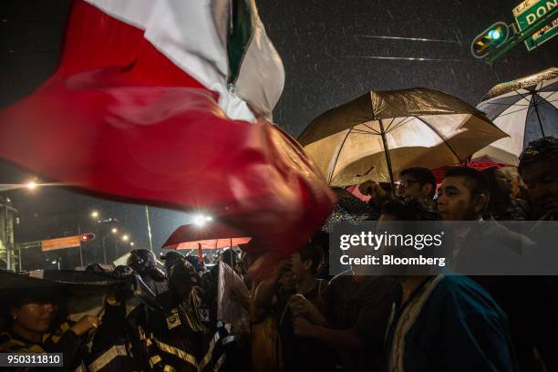 Supporters of Andres Manuel Lopez Obrador, presidential candidate of the National Regeneration Movement Party , wave the Mexican flag during the...