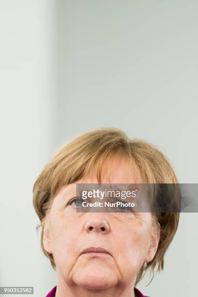German Chancellor Angela Merkel is pictured as she gives a statement to the press together with United Nations High Commissioner for Refugees Filippo...