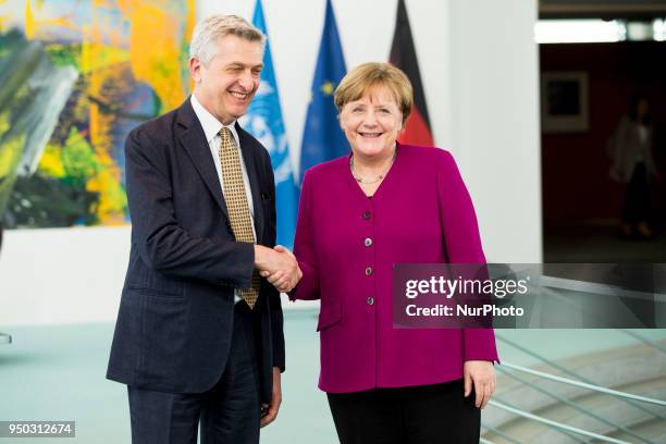 German Chancellor Angela Merkel and United Nations High Commissioner for Refugees Filippo Grandi shake hands after giving a statement to the press...