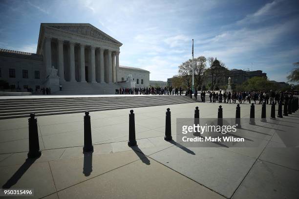 People wait in line to enter the U.S. Supreme Court, on April 23, 2018 in Washington, DC. Today the high court is hearing arguments in Chavez-Mesa v....