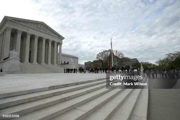 People wait in line to enter the U.S. Supreme Court, on April 23, 2018 in Washington, DC. Today the high court is hearing arguments in Chavez-Mesa v....