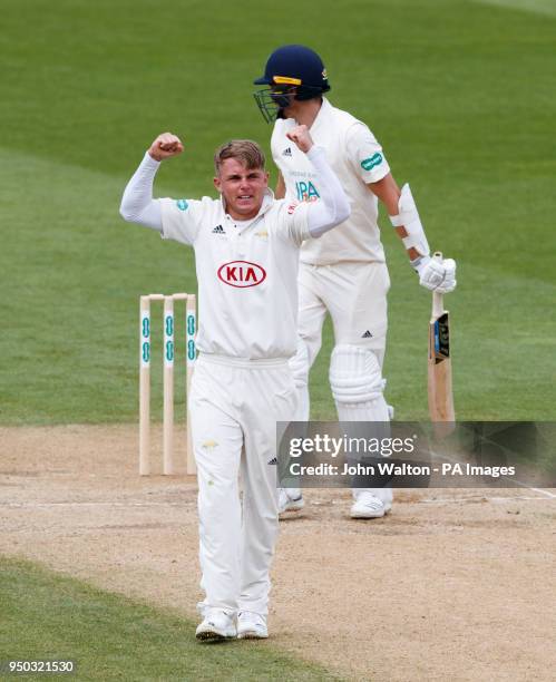 Surrey's Sam Curran celebrates taking the wicket of Hampshire's Chris Wood for 26 during the Specsavers County Championship Division One match at the...