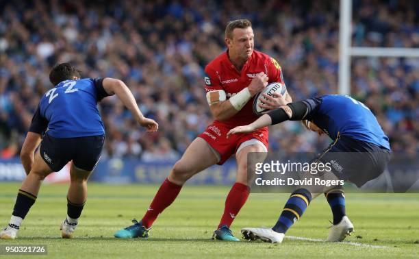 Hadleigh Parkes of the Scarlets runs with the ball during the European Rugby Champions Cup Semi-Final match between Leinster Rugby and Scarlets at...