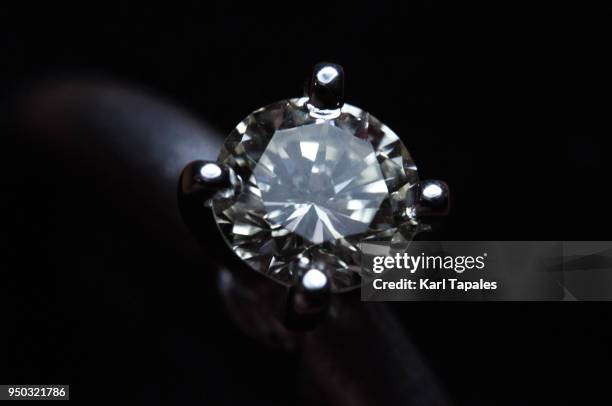 a close up shot of a diamond ring - diamonds black stock-fotos und bilder