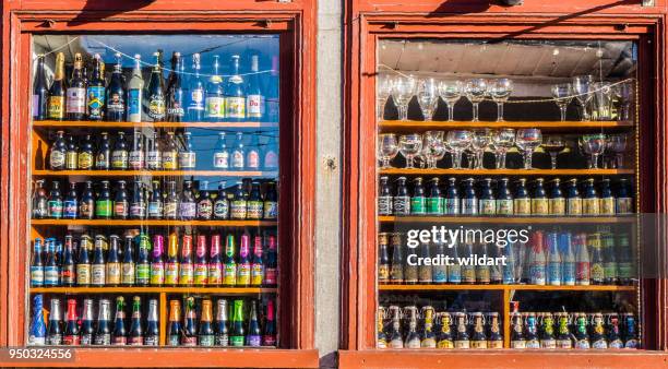 lots of alcoholic drinks in shelfs of a pub - gin tasting stock pictures, royalty-free photos & images