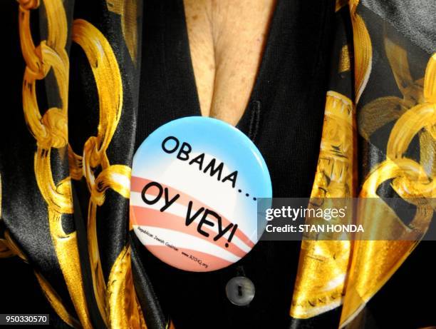 Phyllis Drossman wears her anti-US President Barack Obama button at a Republican Jewish Coalition rally where Republican presidential hopeful Newt...