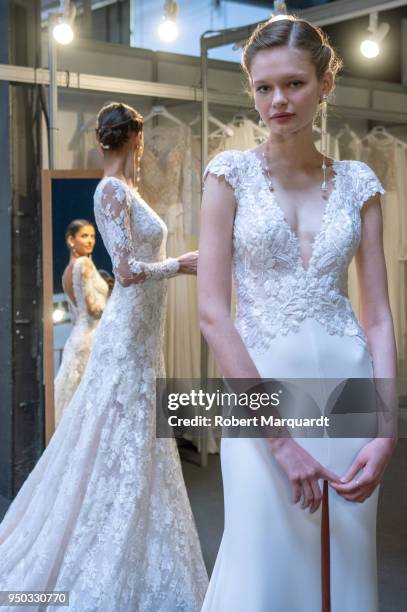 Bruna Lirio and Matiu pose backstage during a Rosa Clara fitting for Barcelona Bridal Week 2018 on April 23, 2018 in Barcelona, Spain.