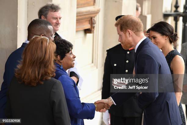 Prince Harry and Meghan Markle are greeted by Doreen Lawrence, Baroness Lawrence of Clarendon as they attend the 25th Anniversary Memorial Service to...