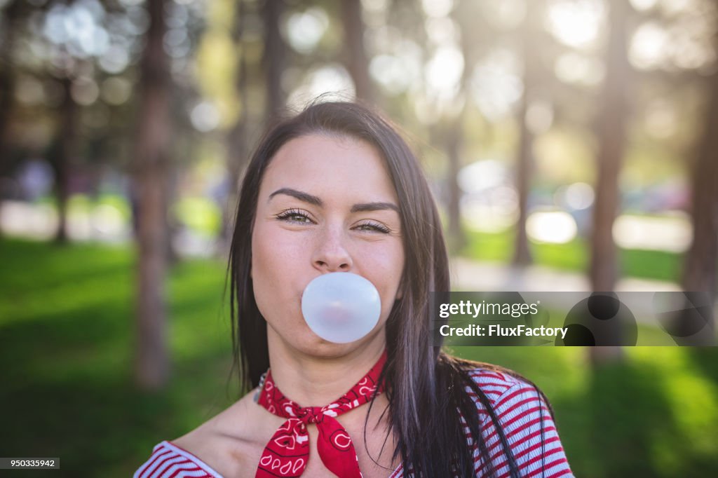 Cute girl with a bubble gum