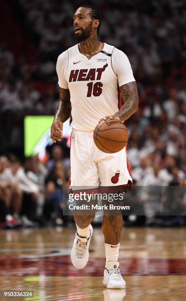 James Johnson of the Miami Heat brings the ball up the court in the third quarter against the Philadelphia 76ers during Game Four of Round One of the...
