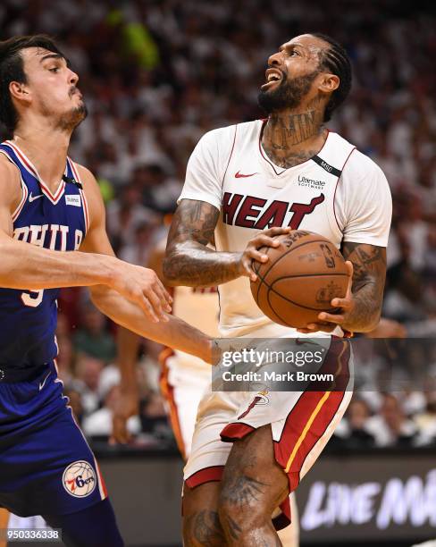 James Johnson of the Miami Heat drives to the basket in the third quarter against the Philadelphia 76ers during Game Four of Round One of the 2018...