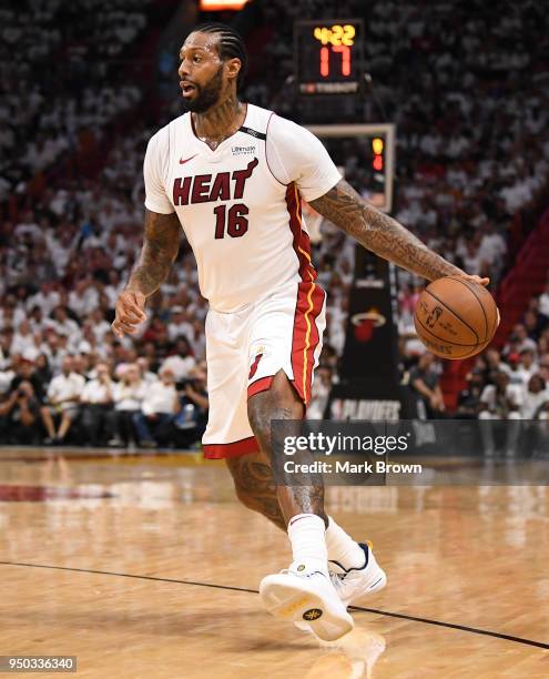 James Johnson of the Miami Heat brings the ball up the court in the third quarter against the Philadelphia 76ers during Game Four of Round One of the...