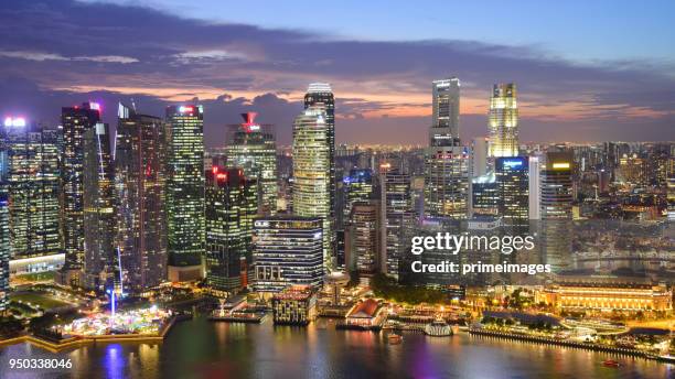 view of the skyline of singapore downtown cbd - marina bay sands skypark stock pictures, royalty-free photos & images