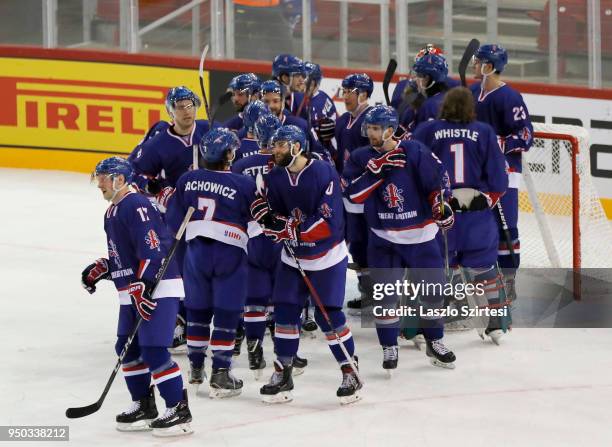 The team of Great Britain celebrate the victory over Slovenia during the 2018 IIHF Ice Hockey World Championship Division I Group A match between...