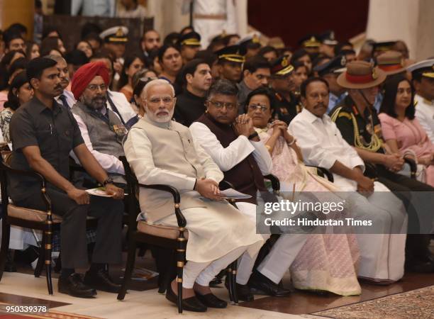 Prime Minister Narendra Modi with Law Minister Ravi Shankar Prasad during the Defense Investiture Ceremony at Rashtrapati Bhawan, on April 23, 2018...