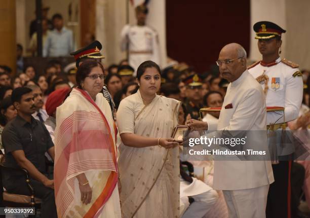 Wife of Major Gosavi Kunal Munnagir, Regiment of Artillery, 166th Battalion receives the Shaurya Chakra from President Ram Nath Kovind as Major...