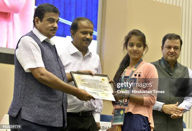 Union Minister Nitin Gadkari presents the first prize in essay writing competition to a student during the inaugural ceremony of the 29th National...