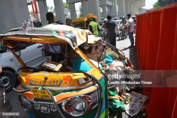 Car and an auto-rickshaw were crushed after the girder fell on them, which was being used by the Delhi Metro for the construction of a foot-over...