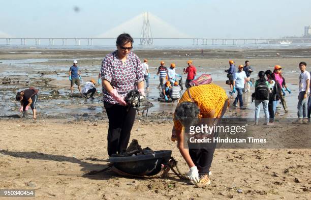 Volunteers participate in beach cleanup and tree plantation drive on the occasion of World Earth Day, at Dadar Chowpatty, on April 22, 2018 in...