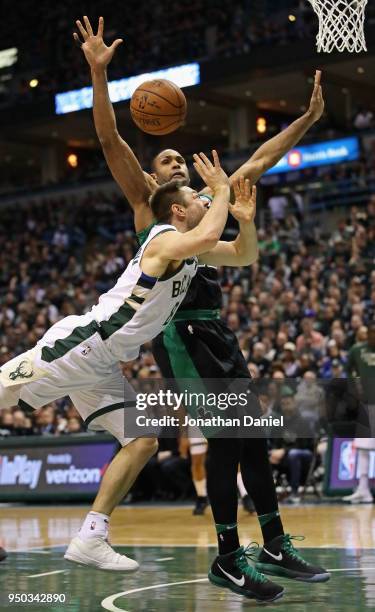 Matthew Dellavedova of the Milwaukee Bucks looses the ball after being fouled by Al Horford of the Boston Celtics during Game Four of Round One of...