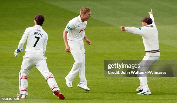 Surrey's Matthew Dunn celebrates taking the final wicket of Hampshire's Sam Notheast for 129 runs to win the match during the Specsavers County...