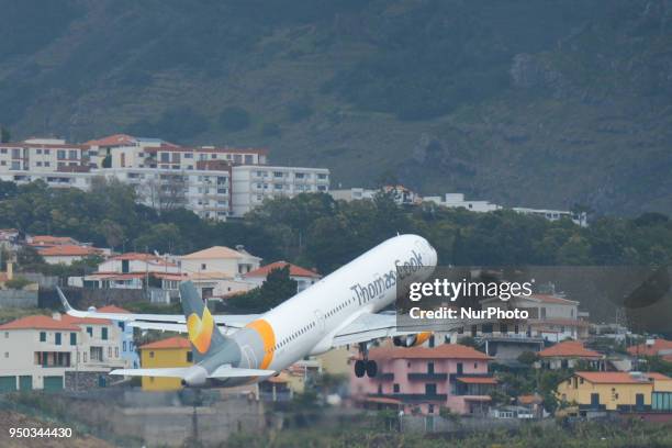 Thomas Cook, a British global travel company plane takes off at Cristiano Ronaldo Madeira International Airport, as flights been cancelled and others...