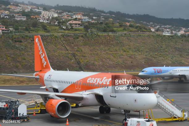 EasyJet plane and TUI Airways plane seen grounded at Cristiano Ronaldo Madeira International Airport, as flights been cancelled and others are...