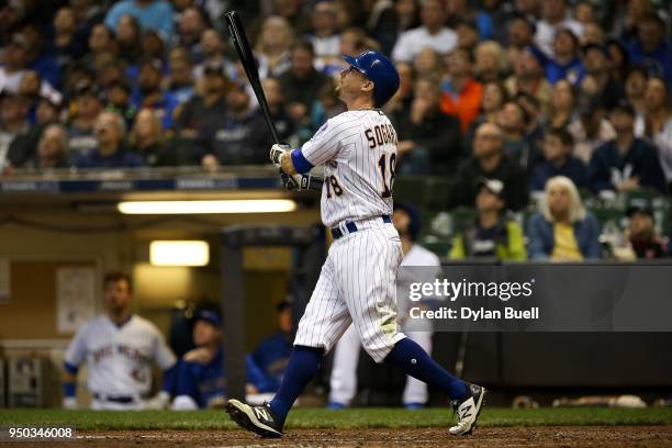 Eric Sogard of the Milwaukee Brewers hits a double in the eighth inning against the Miami Marlins at Miller Park on April 21, 2018 in Milwaukee,...