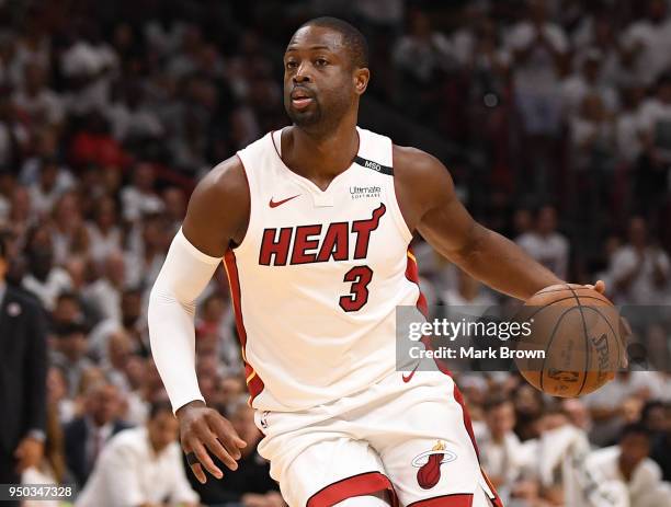 Dwyane Wade of the Miami Heat in action looks to pass in the fourth quarter in Game Four of Round One of the 2018 NBA Playoffs between the Miami Heat...