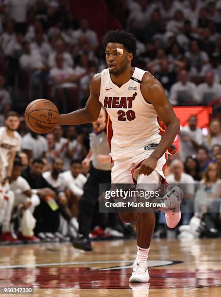 Justise Winslow of the Miami Heat brings the ball up the court in the third quarter in Game Four of Round One of the 2018 NBA Playoffs between the...