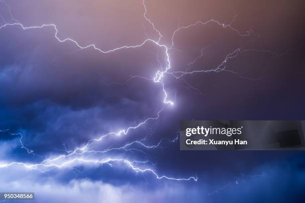 lightning in the night sky during a thunderstorm - cyclone stockfoto's en -beelden