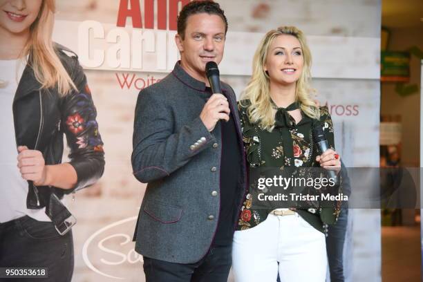 Anna-Carina Woitschack and her boyfriend Stefan Mross promote their new album 'Liebe passiert' at Lausitz Park shopping mall on April 23, 2018 in...