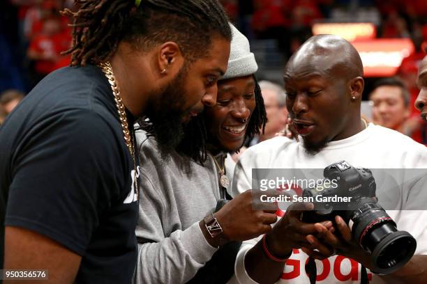 New Orleans Saints Players Cameron Jordan, Alvin Kamara and Chris Banjo look at a camera while attending Game 3 of the Western Conference playoffs...