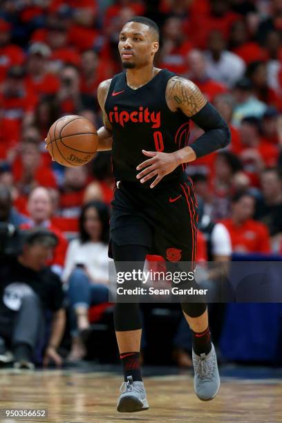 Damian Lillard of the Portland Trail Blazers dribbles the ball down court during Game 3 of the Western Conference playoffs against the New Orleans...