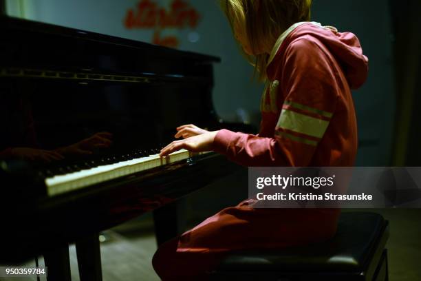 young girl playing piano - pianist stock pictures, royalty-free photos & images
