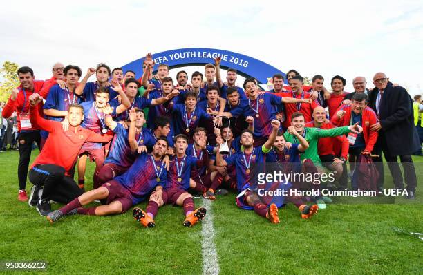 Barcelona players celebrate with the trophy following the UEFA Youth League Final between Chelsea FC and FC Barcelona at Colovray Sports Centre on...