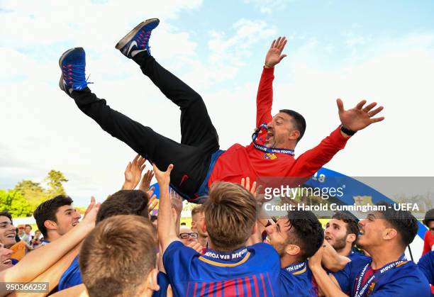 Barcelona players and coach Francisco Pimienta celebrate at the final whistle following the UEFA Youth League Final between Chelsea FC and FC...